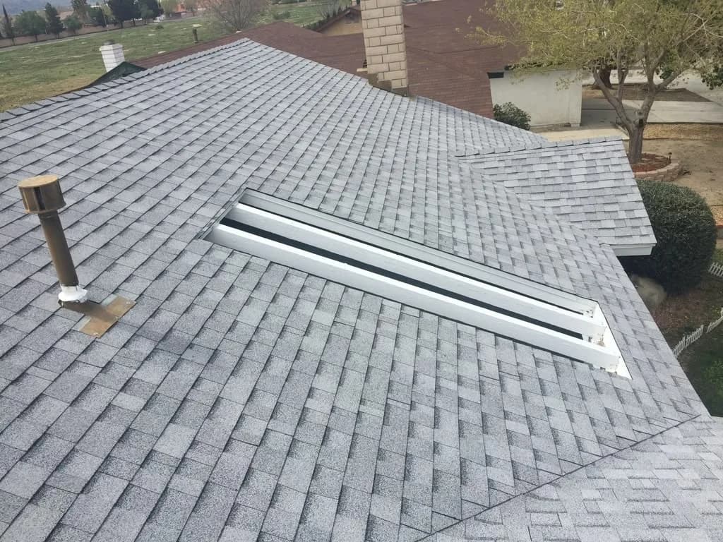 New skylight frame installed in an asphalt shingle roof