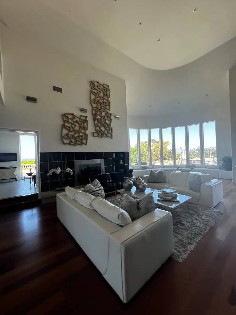 Living room fireplace and wall art by Top Tech Builders