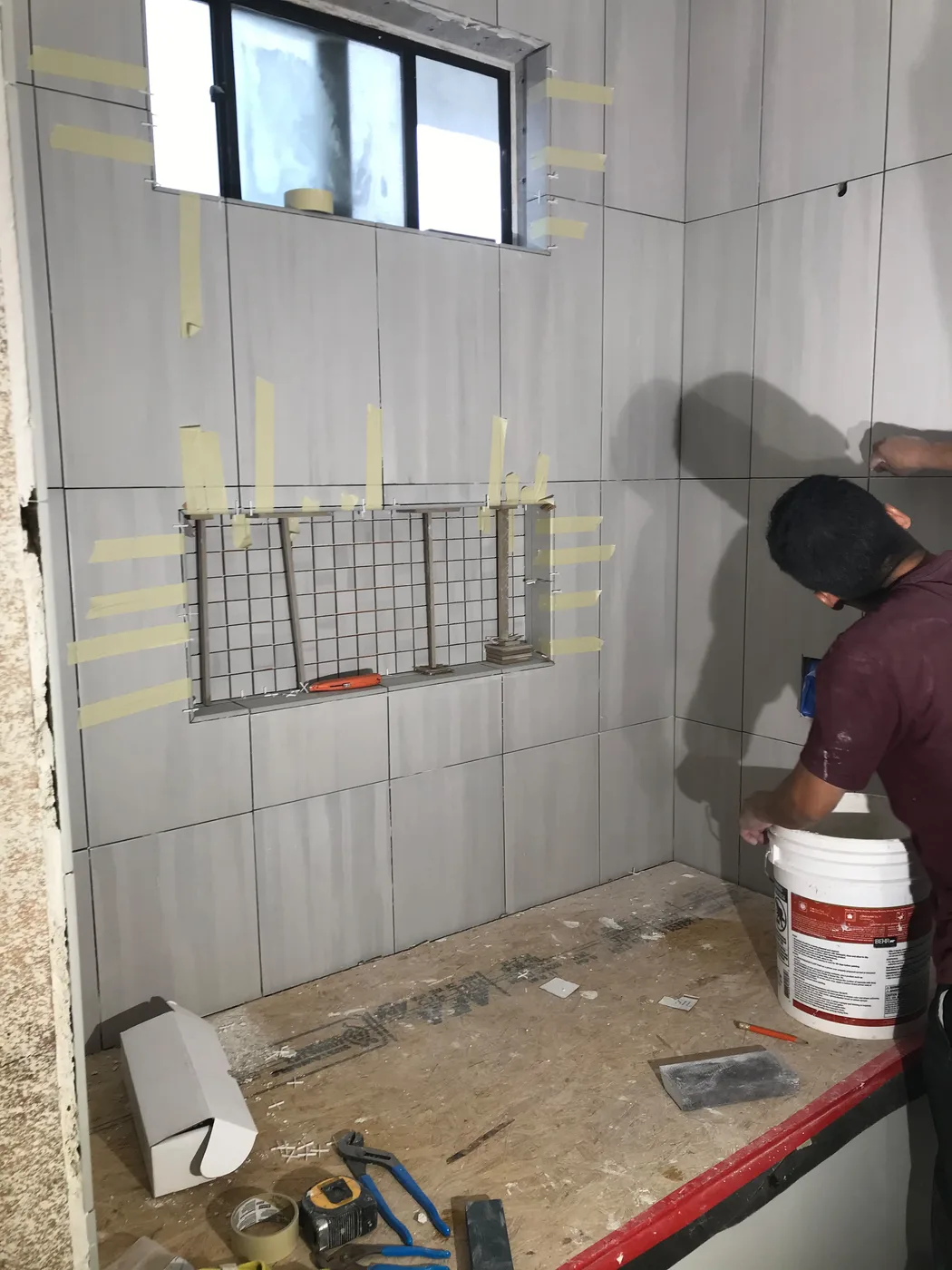 Bathroom tile installation by Top Tech Builders