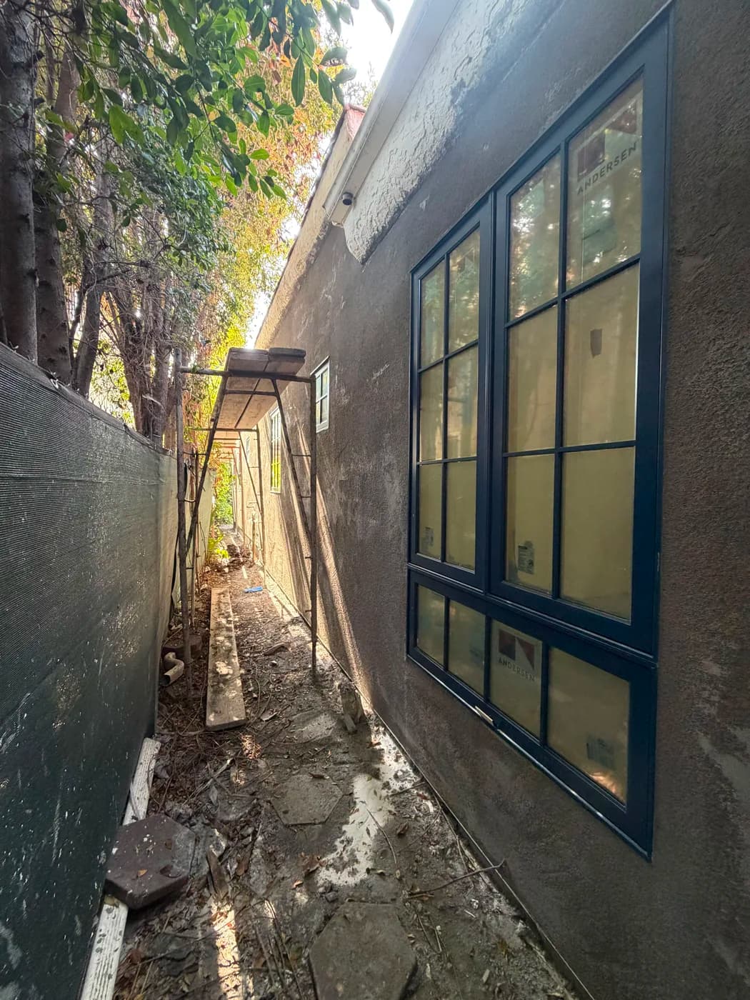 New window installation on stucco exterior by Top Tech Builders