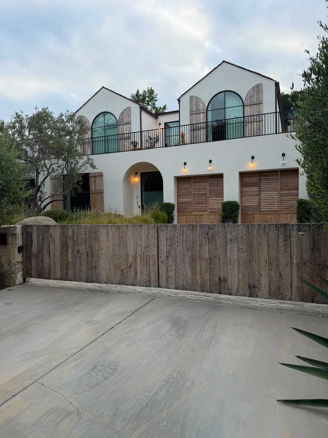 Completed Mediterranean-style home exterior remodel by Top Tech Builders