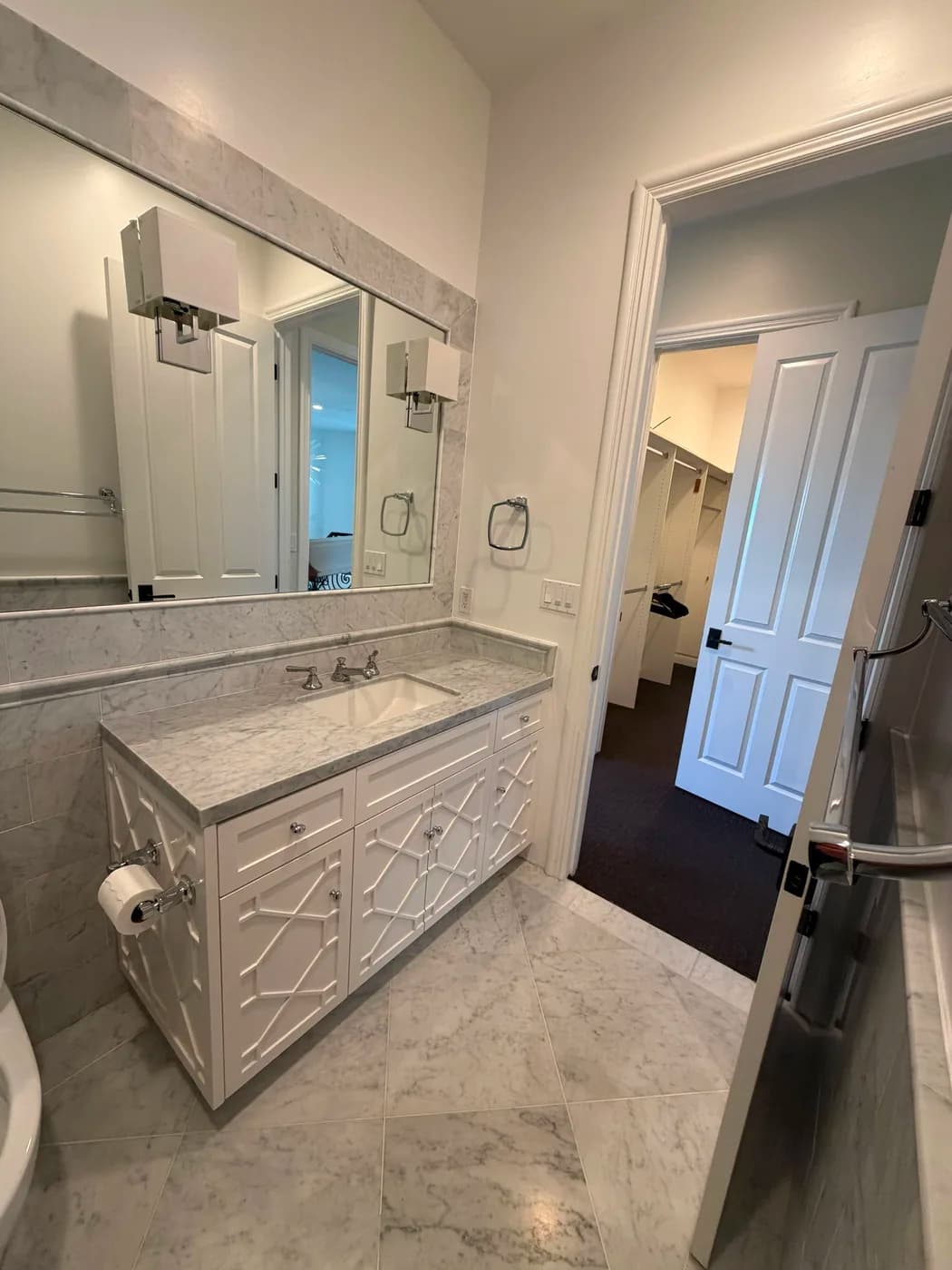 White marble bathroom vanity remodel by Top Tech Builders