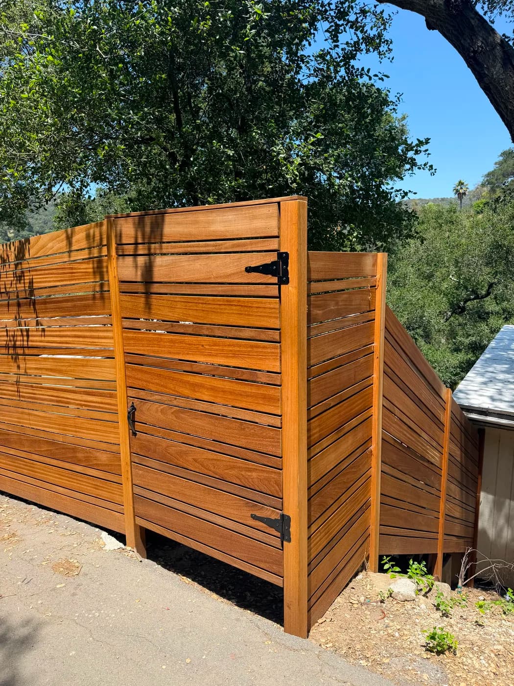 Custom wood slat fence and gate by Top Tech Builders