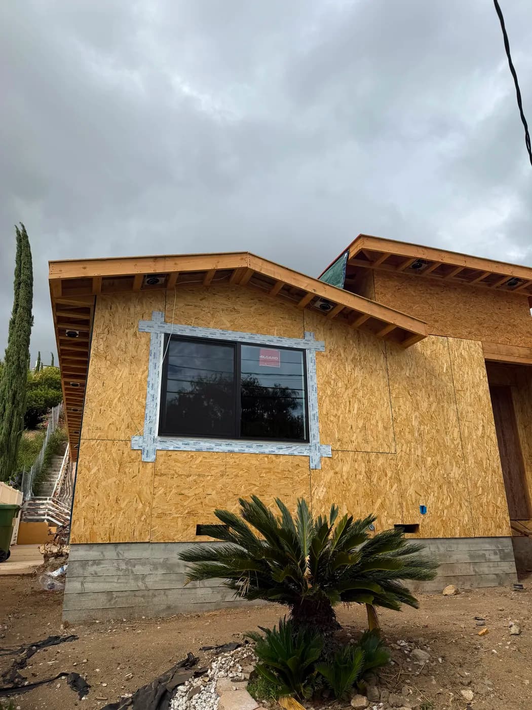 New home exterior sheathing and framing by Top Tech Builders