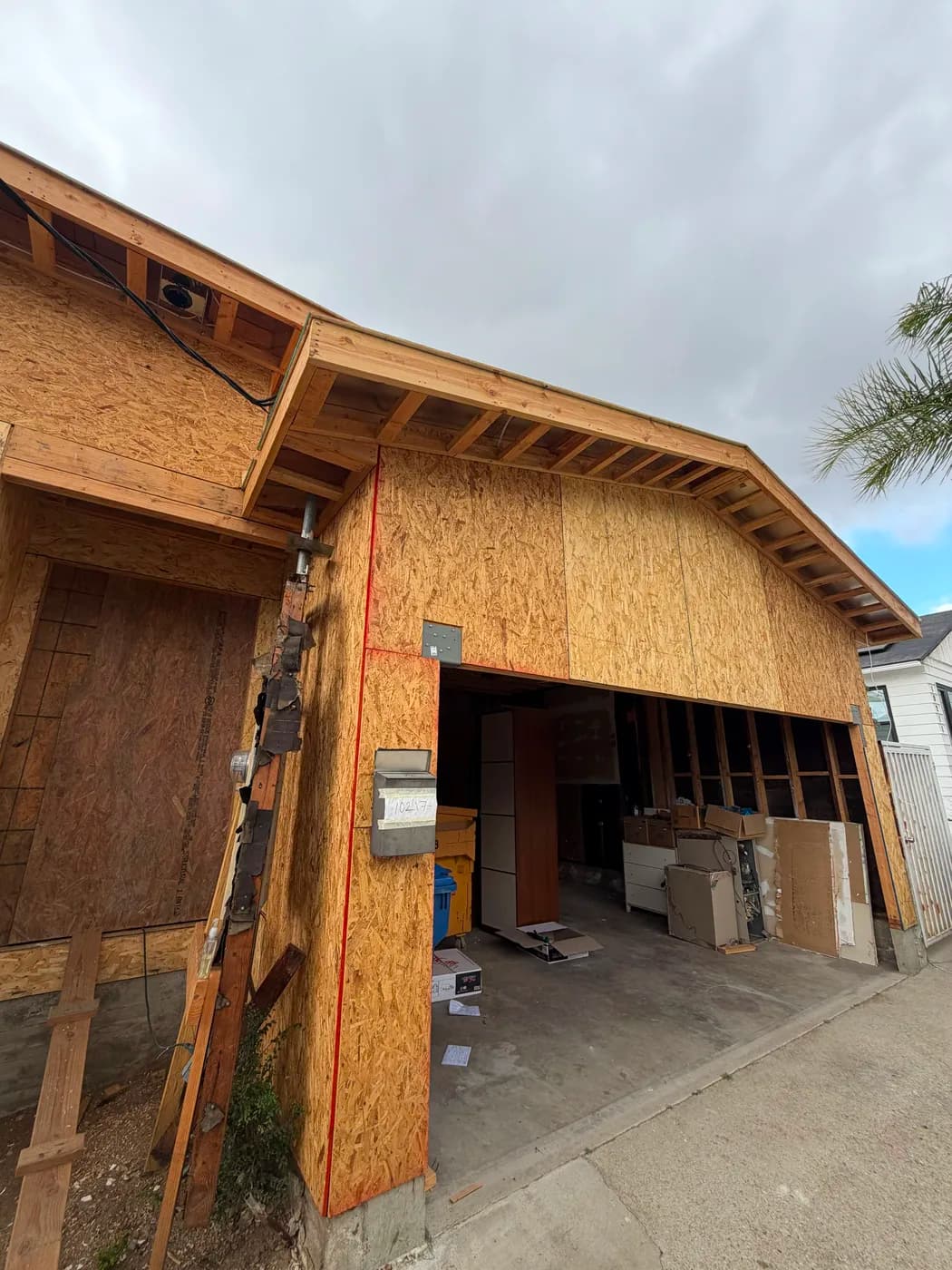 Garage addition exterior under construction by Top Tech Builders