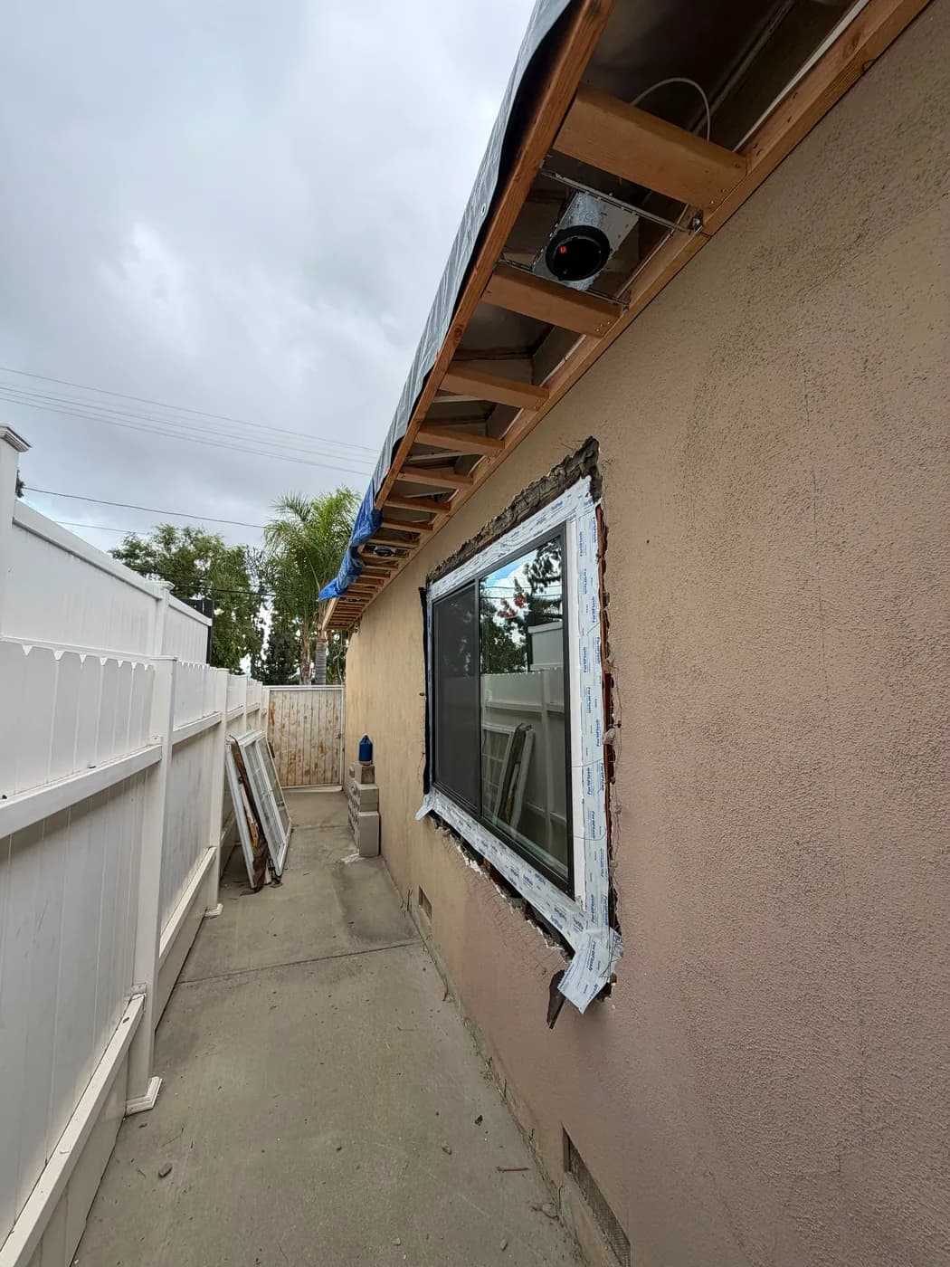 New window installation on exterior wall by Top Tech Builders