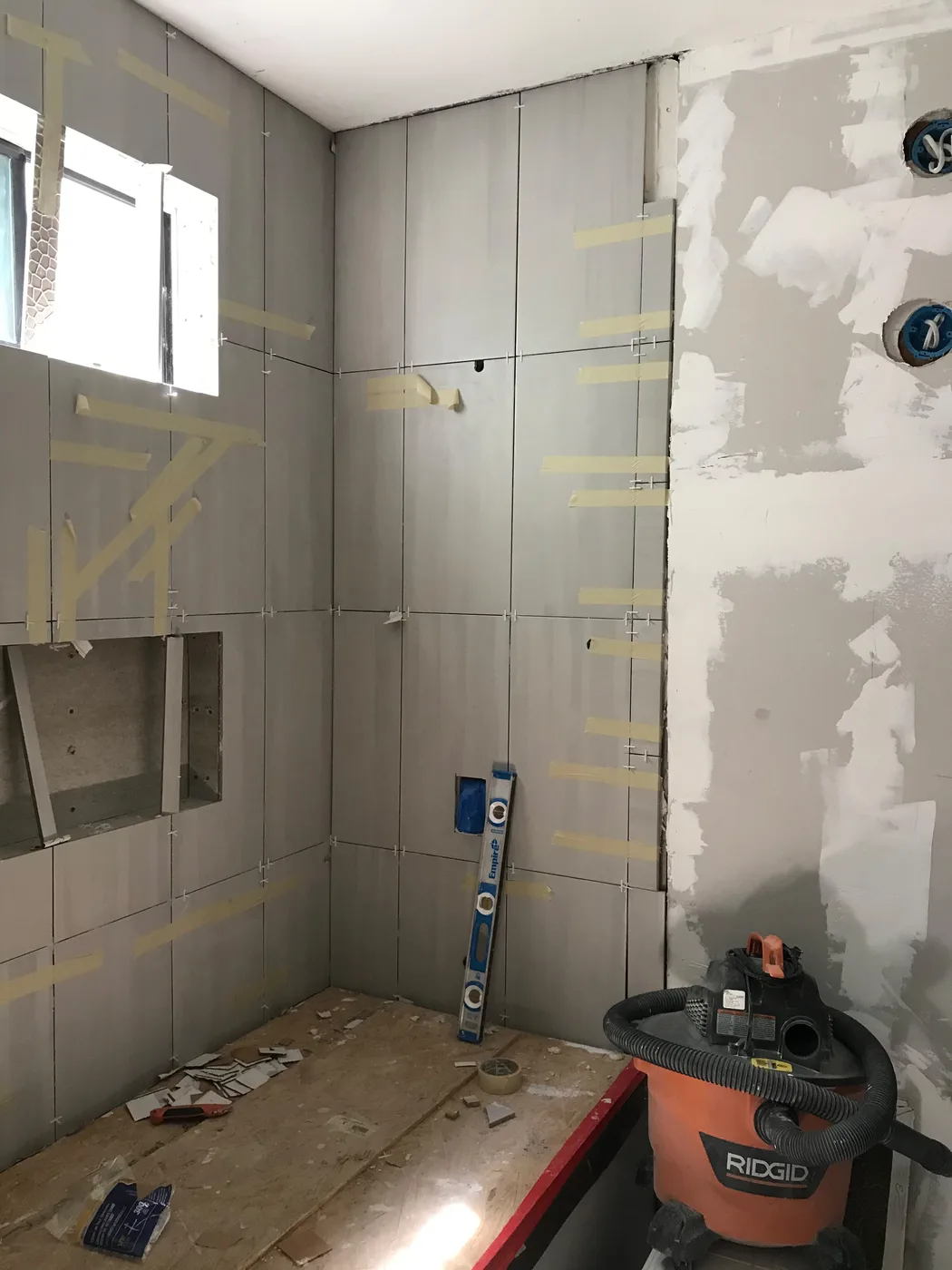 Bathroom tile installation by Top Tech Builders