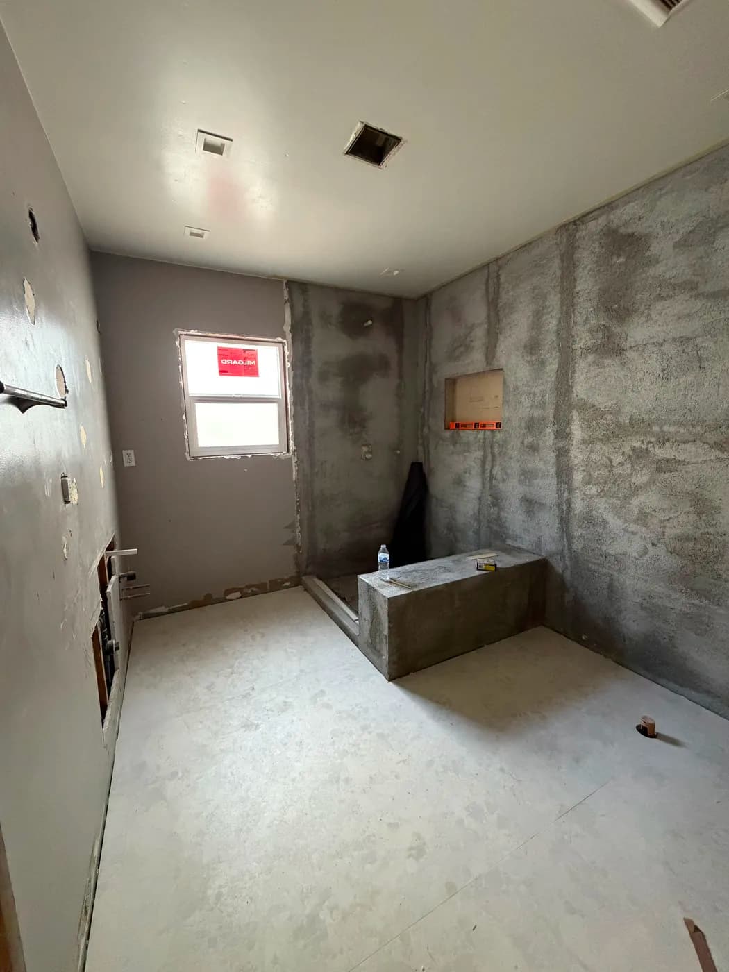 Bathroom shower waterproofing in progress by Top Tech Builders