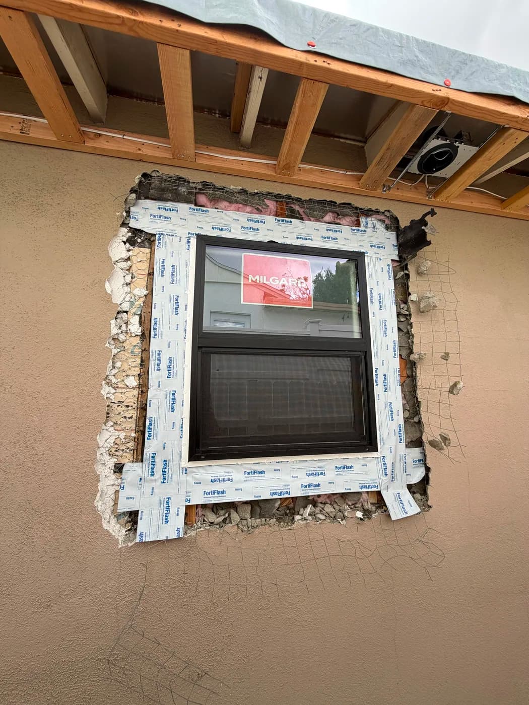 Window installation with waterproof flashing by Top Tech Builders